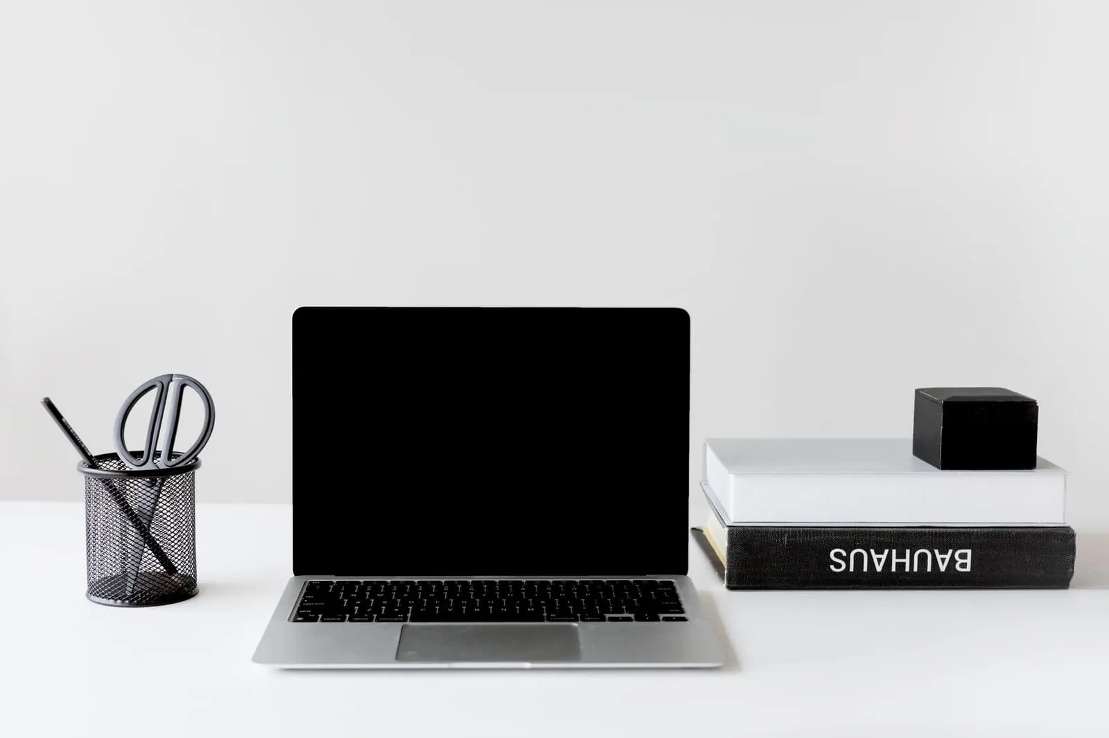 A laptop on a white table
